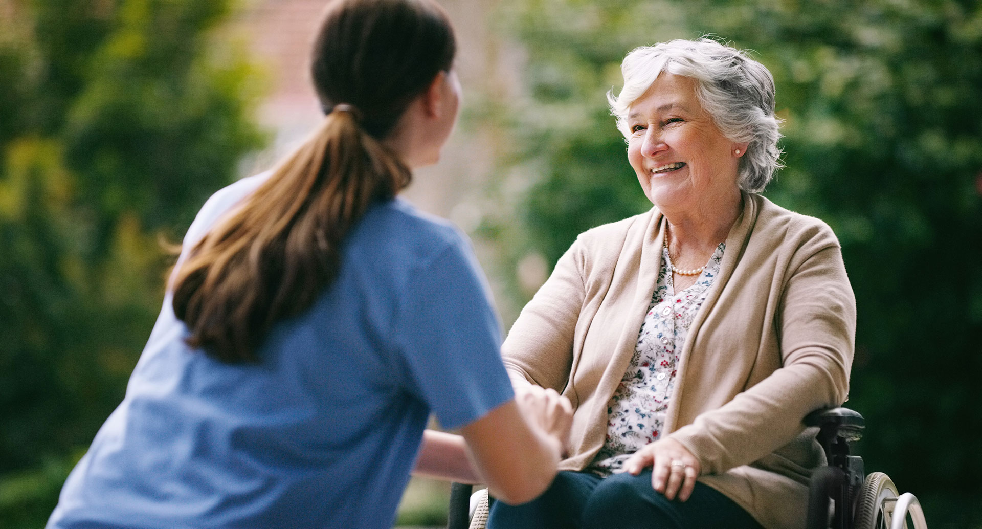 Lady smiling and talking to nurse